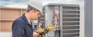 AC repair technician servicing outdoor condenser unit in Canoga Park CA