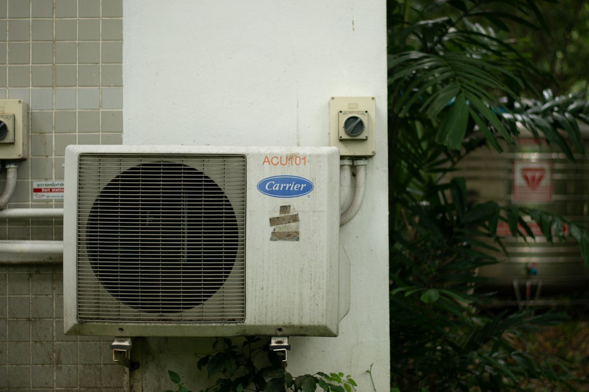 Close-up of home AC vent unit showing signs needing inspection
