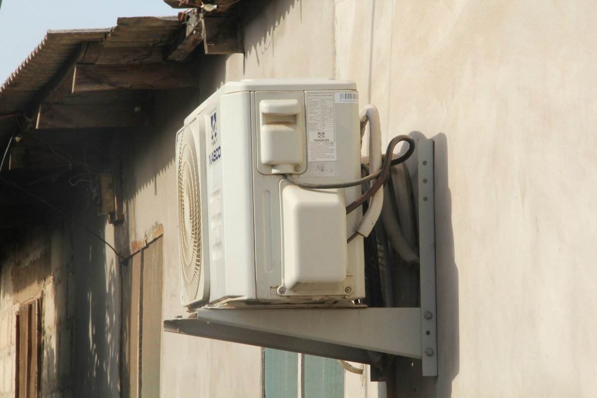 AC unit mounted on side of building