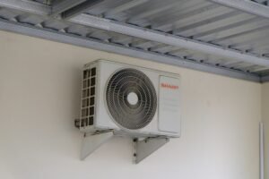 AC unit mounted on wall representing cost-effective repair service