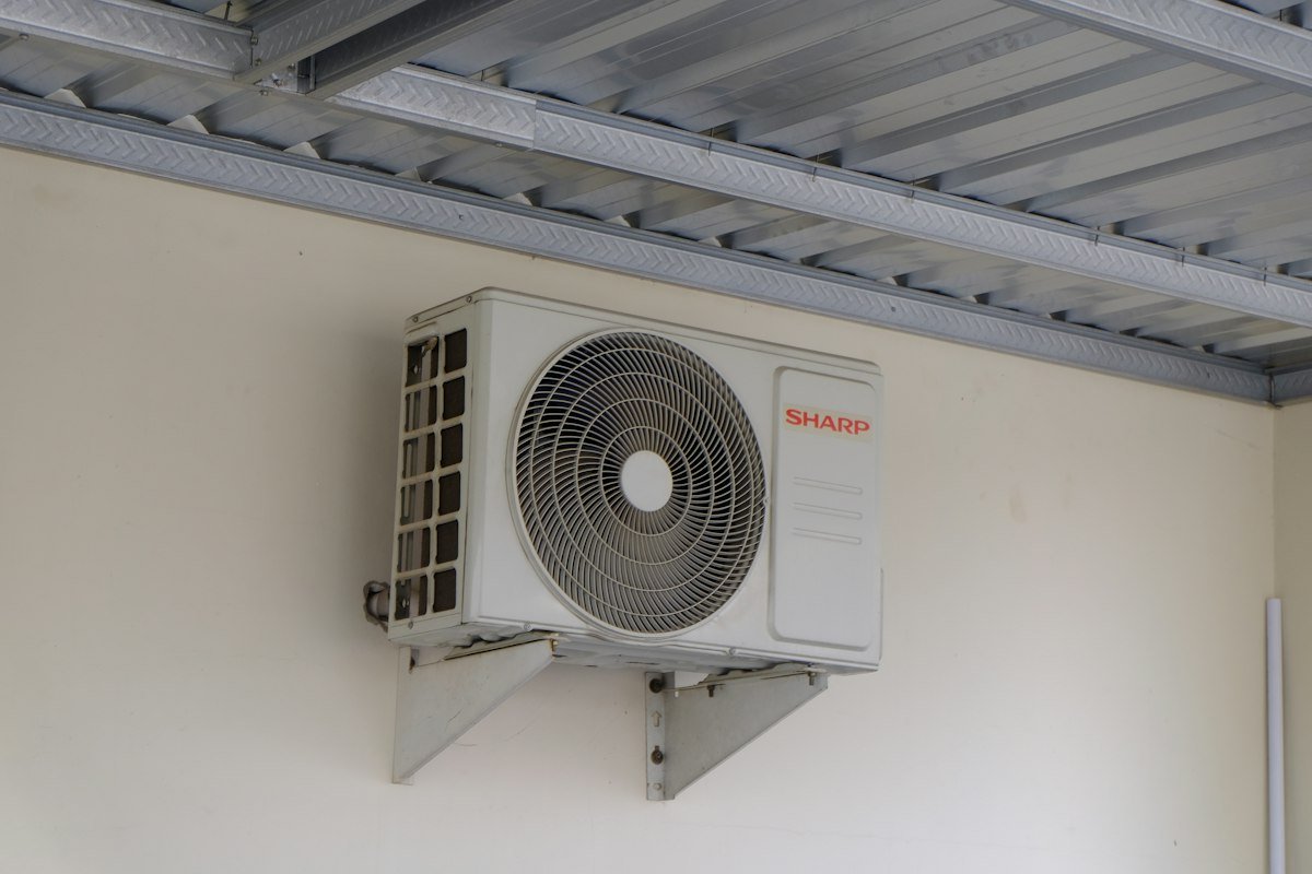 AC unit mounted on wall representing cost-effective repair service