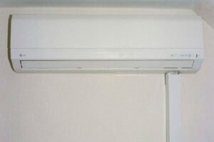 Modern white high-efficiency AC unit mounted on wall
