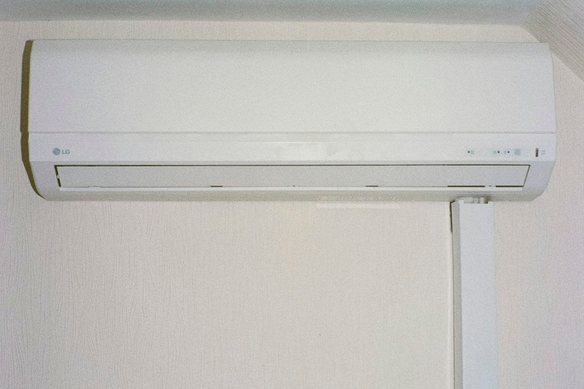 Modern white high-efficiency AC unit mounted on wall